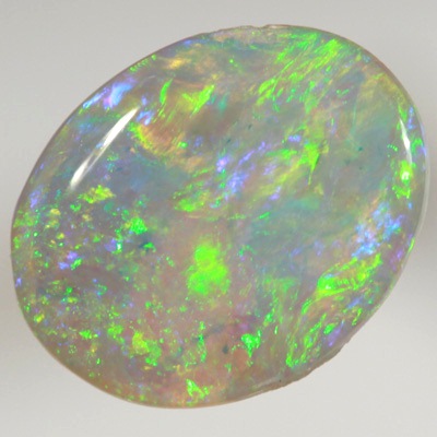 SOLID CRYSTAL OPAL Bright sparkles of greens throughout a purple hue